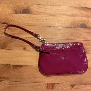 Plum Coach Wristlet!
